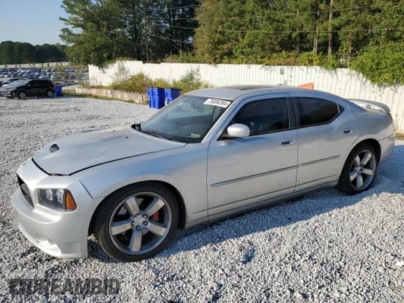 2006 Dodge Charger SRT-8 с VIN 2B3KA73W36H386207, выставлен на аукционе Copart как лот 75006284 с пробегом 241 997 миль миль и Списание • Salvage title. История ставок и продаж доступна на DreamBid. Изображение 1.