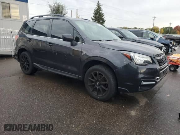 2018 Subaru Forester Limited with VIN JF2SJARCXJH519716, listed as a Copart auction lot 82580805 with 137,336 mi miles and Salvage title. Bid and sale history available at DreamBid. Image 4.