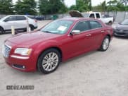 ✅ 2014 Chrysler 300 C • VIN: 2C3CCAKT7EH273333 • Lot: 42771169. Listed on IAAI with 127,380 mi. Free auction sales archive from the USA and detailed vehicle history report at DreamBid. Image 2.