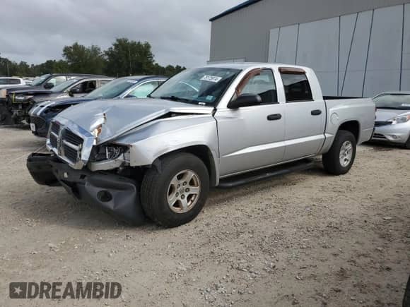 2005 Dodge Dakota SLT with VIN 1D7HE48K35S337930, listed as a Copart auction lot 79175974 with 114,816 mi miles and Salvage title. Bid and sale history available at DreamBid. Image 1.