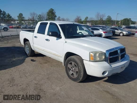 2005 Dodge Dakota Laramie with VIN 1D7HE58N95S138915, listed as a IAAI auction lot 41789883 with 342,402 mi miles and . Bid and sale history available at DreamBid. Image 1.