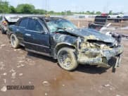 ✅ 1999 Lincoln Town Car Cartier • VIN: 1LNHM83W0XY673738 • Lot: 42437877. Listed on IAAI with 143,018 mi. Free auction sales archive from the USA and detailed vehicle history report at DreamBid. Image 1.