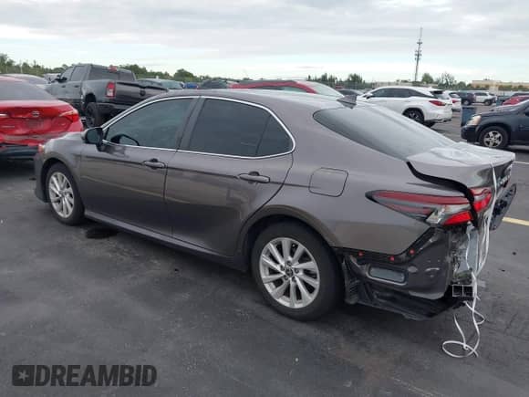 2022 Toyota Camry LE with VIN 4T1C11AK0NU653830, listed as a IAAI auction lot 43428154 with 21,960 mi miles and . Bid and sale history available at DreamBid. Image 3.