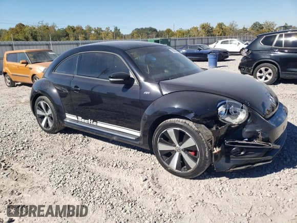 ✅ 2014 Volkswagen Beetle Turbo R-Line • VIN: 3VWVT7AT9EM636111 • Lot: 76061634. Listed on Copart with 94,021 mi. Free auction sales archive from the USA and detailed vehicle history report at DreamBid. Image 4.