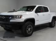 ✅ 2020 Chevrolet Colorado 4WD ZR2 • VIN: 1GCPTEE19L1134962 • Lot: 59032865. Listed on Copart with 143,010 mi. Free auction sales archive from the USA and detailed vehicle history report at DreamBid. Image 2.