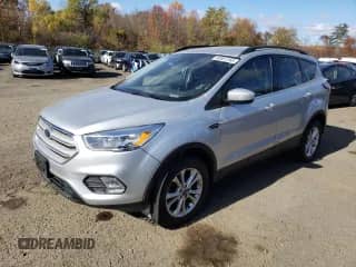 2018 Ford Escape SE с VIN 1FMCU9GD4JUA75143, выставлен на аукционе Copart как лот 89861265 с пробегом 93 549 миль миль и Чистый • Clean title. История ставок и продаж доступна на DreamBid. Изображение 1.