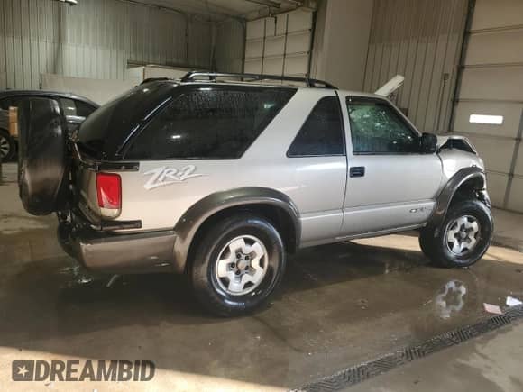 2004 Chevrolet Blazer LS с VIN 1GNCT18X34K143280, выставлен на аукционе Copart как лот 50494785 с пробегом Не указан миль и Списание • Salvage title. История ставок и продаж доступна на DreamBid. Изображение 3.