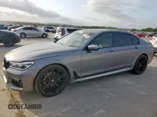 ✅ 2018 BMW 7 Series 750i • VIN: WBA7F0C52JGM23950 • Лот: 61341985. Опубликован ранее на Copart с пробегом 70 268 миль. Бесплатный доступ к архиву аукционных продаж из США и подробный отчёт об истории автомобиля на DreamBid. Изображение 1.