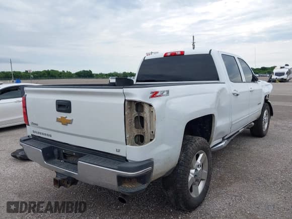 ✅ 2017 Chevrolet Silverado 2500HD LT • VIN: 1GC1KVEG6HF101957 • Lot: 42343984. Listed on IAAI with 313,934 mi. Free auction sales archive from the USA and detailed vehicle history report at DreamBid. Image 4.