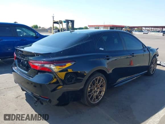 2023 Toyota Camry SE with VIN 4T1G11BK2PU105668, listed as a IAAI auction lot 43013320 with 39,694 mi miles and . Bid and sale history available at DreamBid. Image 4.