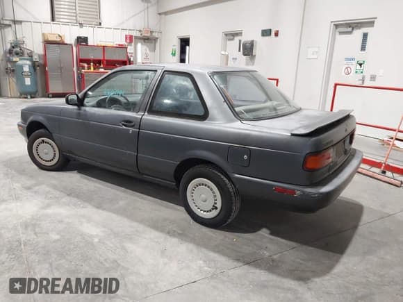 ✅ 1991 Nissan Sentra E • VIN: 1N4EB32A2MC701771 • Lot: 43669744. Listed on IAAI with 140,209 mi. Free auction sales archive from the USA and detailed vehicle history report at DreamBid. Image 3.