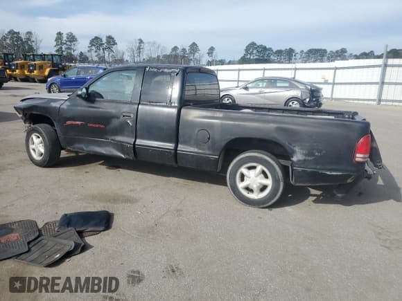 ✅ 1998 Dodge Dakota SLT • VIN: 1B7GL22X3WS718795 • Lot: 46650745. Wystawiony na Copart z przebiegiem 198 682 mil. Bezpłatny archiwum sprzedaży aukcyjnych z USA i szczegółowy raport historii pojazdu na DreamBid. Zdjęcie 2.