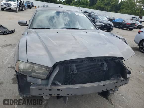 2012 Dodge Charger SXT с VIN 2C3CDXHG6CH126234, выставлен на аукционе Copart как лот 70297715 с пробегом 142 644 миль миль и Списание • Salvage title. История ставок и продаж доступна на DreamBid. Изображение 5.