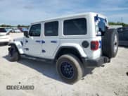 ✅ 2022 Jeep Wrangler Unlimited Sahara Altitude • VIN: 1C4HJXEG1NW254593 • Lot: 64974425. Listed on Copart with 50,215 mi. Free auction sales archive from the USA and detailed vehicle history report at DreamBid. Image 2.