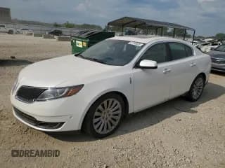 ✅ 2015 Lincoln MKS • VIN: 1LNHL9DK0FG601091 • Lot: 67738325. Wystawiony na Copart z przebiegiem 128 997 mil. Bezpłatny archiwum sprzedaży aukcyjnych z USA i szczegółowy raport historii pojazdu na DreamBid. Zdjęcie 1.