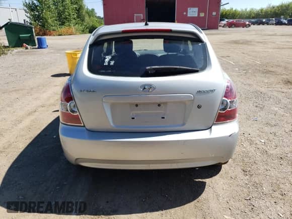 2010 Hyundai Accent L with VIN KMHCN3BCXAU182917, listed as a Copart auction lot 69464685 with 124,678 mi miles and Salvage title. Bid and sale history available at DreamBid. Image 6.