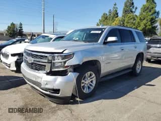 2020 Chevrolet Tahoe LT z VIN 1GNSKBKC0LR266812, wystawiony jako Copart lot #82636215 z przebiegiem Nie podano mil oraz Szkoda całkowita • Salvage title. Historia ofert i sprzedaży dostępna na DreamBid. Obrazek 1.