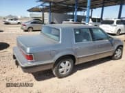 ✅ 1991 Dodge Dynasty LE • VIN: 1B3XC56R9MD115785 • Lot: 48073715. Listed on Copart with 64,483 mi. Free auction sales archive from the USA and detailed vehicle history report at DreamBid. Image 3.