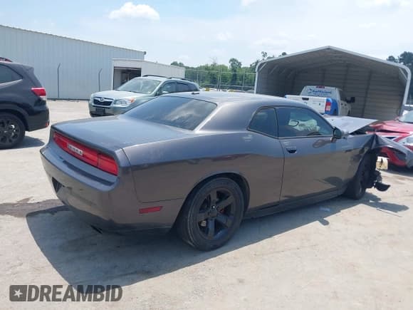 ✅ 2013 Dodge Challenger SXT • VIN: 2C3CDYAG2DH573967 • Lot: 42580376. Listed on IAAI with 132,804 mi. Free auction sales archive from the USA and detailed vehicle history report at DreamBid. Image 4.