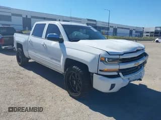 ✅ 2016 Chevrolet Silverado 1500 LT • VIN: 3GCUKREC3GG143985 • Lot: 43594584. Listed on IAAI with 209,894 mi. Free auction sales archive from the USA and detailed vehicle history report at DreamBid. Image 1.
