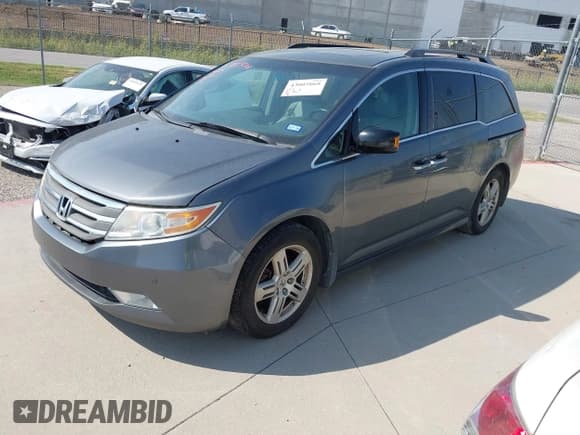 ✅ 2012 Honda Odyssey Touring • VIN: 5FNRL5H97CB501620 • Лот: 43005068. Опубликован ранее на IAAI с пробегом 160 233 миль. Бесплатный доступ к архиву аукционных продаж из США и подробный отчёт об истории автомобиля на DreamBid. Изображение 2.