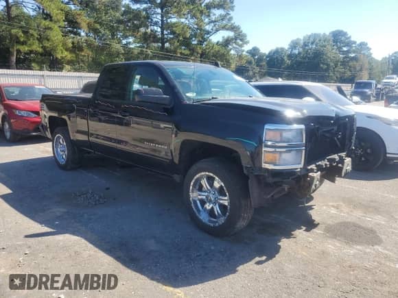 2015 Chevrolet Silverado 1500 LT with VIN 1GCRCREC1FZ439153, listed as a Copart auction lot 85944105 with 196,972 mi miles and Salvage title. Bid and sale history available at DreamBid. Image 4.