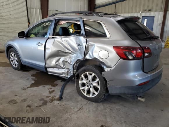 ✅ 2015 Mazda CX-9 Touring • VIN: JM3TB2CA1F0447685 • Lot: 69888835. Wystawiony na Copart z przebiegiem 136 762 mil. Bezpłatny archiwum sprzedaży aukcyjnych z USA i szczegółowy raport historii pojazdu na DreamBid. Zdjęcie 2.