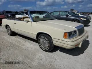 ✅ 1986 Chrysler LeBaron • VIN: 1C3BC55D0GG153072 • Lot: 77865854. Wystawiony na Copart z przebiegiem 74 922 mil. Bezpłatny archiwum sprzedaży aukcyjnych z USA i szczegółowy raport historii pojazdu na DreamBid. Zdjęcie 4.