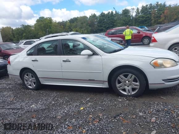 2016 Chevrolet Impala LT with VIN 2G1WB5E3XG1127706, listed as a IAAI auction lot 43407642 with 145,236 mi miles and . Bid and sale history available at DreamBid. Image 13.