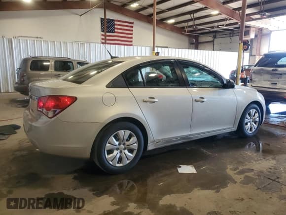✅ 2014 Chevrolet Cruze LS • VIN: 1G1PA5SG6E7230085 • Lot: 90124465. Listed on Copart with 104,605 mi. Free auction sales archive from the USA and detailed vehicle history report at DreamBid. Image 3.