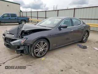 ✅ 2018 Maserati Ghibli S Q4 GranLusso • VIN: ZAM57YTL8J1265648 • Лот: 56295795. Опубликован ранее на Copart с пробегом 51 857 миль. Бесплатный доступ к архиву аукционных продаж из США и подробный отчёт об истории автомобиля на DreamBid. Изображение 1.