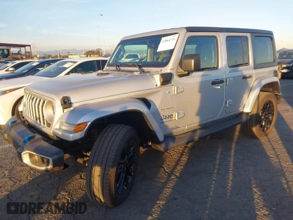 ✅ 2023 Jeep Wrangler Sahara • VIN: 1C4JJXP65PW630477 • Lot: 43864711. Listed on IAAI with 10,033 mi. Free auction sales archive from the USA and detailed vehicle history report at DreamBid. Image 2.
