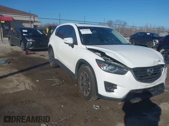 ✅ 2016 Mazda CX-5 Grand Touring • VIN: JM3KE4DY6G0864294 • Lot: 43639964. Wystawiony na IAAI z przebiegiem 119 285 mil. Bezpłatny archiwum sprzedaży aukcyjnych z USA i szczegółowy raport historii pojazdu na DreamBid. Zdjęcie 1.