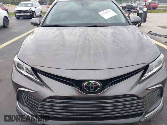 2022 Toyota Camry LE with VIN 4T1C11AK0NU653830, listed as a IAAI auction lot 43428154 with 21,960 mi miles and . Bid and sale history available at DreamBid. Image 13.