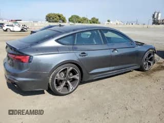 ✅ 2022 Audi RS 5 Sportback • VIN: WUAAWCF52NA901057 • Lot: 62050164. Wystawiony na Copart z przebiegiem 22 175 mil. Bezpłatny archiwum sprzedaży aukcyjnych z USA i szczegółowy raport historii pojazdu na DreamBid. Zdjęcie 3.
