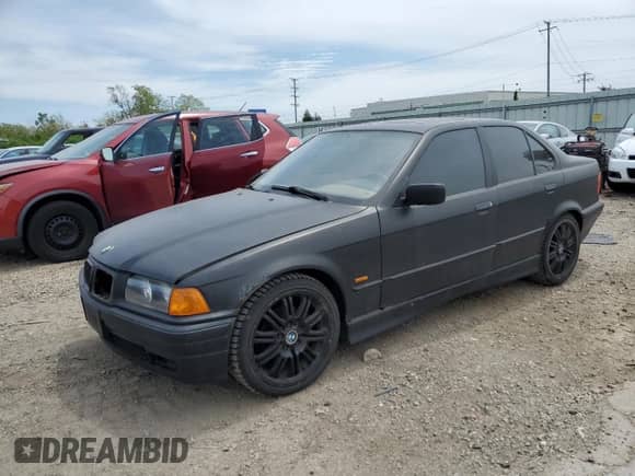 1998 BMW 3 Series 328i with VIN WBACD4329WAV60069, listed as a Copart auction lot 57724115 with 113,414 mi miles and Clean title. Bid and sale history available at DreamBid. Image 1.