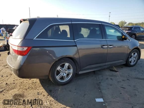 ✅ 2012 Honda Odyssey Touring • VIN: 5FNRL5H94CB054485 • Лот: 81196235. Опубликован ранее на Copart с пробегом 212 044 миль. Бесплатный доступ к архиву аукционных продаж из США и подробный отчёт об истории автомобиля на DreamBid. Изображение 3.