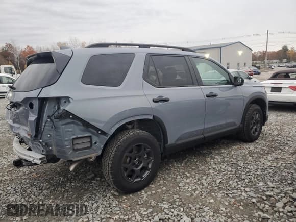 ✅ 2025 Honda Pilot TrailSport • VIN: 5FNYG1H6XSB160050 • Лот: 90994185. Опубликован ранее на Copart с пробегом 1 521 миль. Бесплатный доступ к архиву аукционных продаж из США и подробный отчёт об истории автомобиля на DreamBid. Изображение 3.