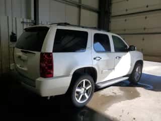 2014 Chevrolet Tahoe LTZ с VIN 1GNSKCE05ER127284, выставлен на аукционе Copart как лот 85735245 с пробегом 152 890 миль миль и Чистый • Clean title. История ставок и продаж доступна на DreamBid. Изображение 3.
