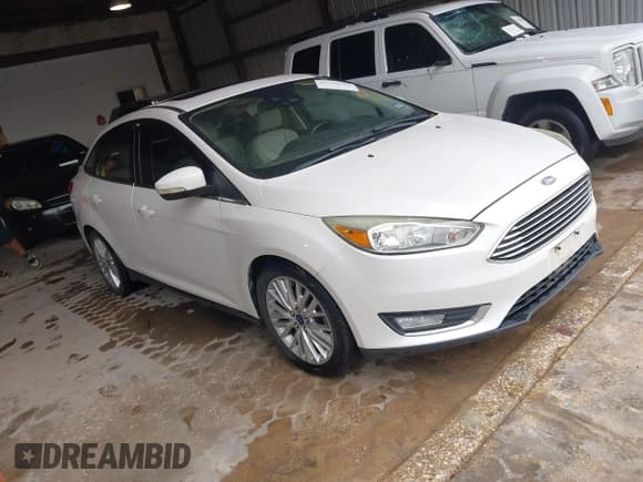 ✅ 2015 Ford Focus Titanium • VIN: 1FADP3J27FL230825 • Lot: 43760266. Listed on IAAI with 75,574 mi. Free auction sales archive from the USA and detailed vehicle history report at DreamBid. Image 1.