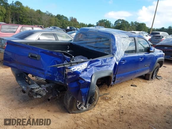 ✅ 2023 Toyota Tacoma TRD Off Road • VIN: 3TMCZ5AN2PM541357 • Lot: 43365447. Listed on IAAI with 94,759 mi. Free auction sales archive from the USA and detailed vehicle history report at DreamBid. Image 4.