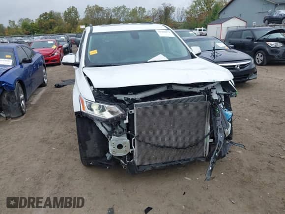 2020 Chevrolet Traverse LT with VIN 1GNEVHKW1LJ300157, listed as a IAAI auction lot 43360072 with 76,992 mi miles and . Bid and sale history available at DreamBid. Image 6.