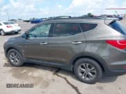 ✅ 2014 Hyundai Santa Fe • VIN: 5XYZUDLB1EG227778 • Lot: 43033757. Listed on IAAI with 135,496 mi. Free auction sales archive from the USA and detailed vehicle history report at DreamBid. Image 14.
