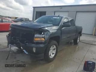 ✅ 2018 Chevrolet Silverado 1500 LT • VIN: 3GCUKREC0JG492979 • Лот: 64141855. Опубликован ранее на Copart с пробегом Не указан. Бесплатный доступ к архиву аукционных продаж из США и подробный отчёт об истории автомобиля на DreamBid. Изображение 1.