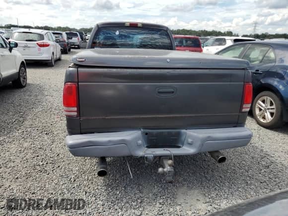 2002 Dodge Dakota Sport z VIN 1B7GL32X62S716927, wystawiony jako Copart lot #74025774 z przebiegiem Nie podano mil oraz Szkoda całkowita • Salvage title. Historia ofert i sprzedaży dostępna na DreamBid. Obrazek 6.