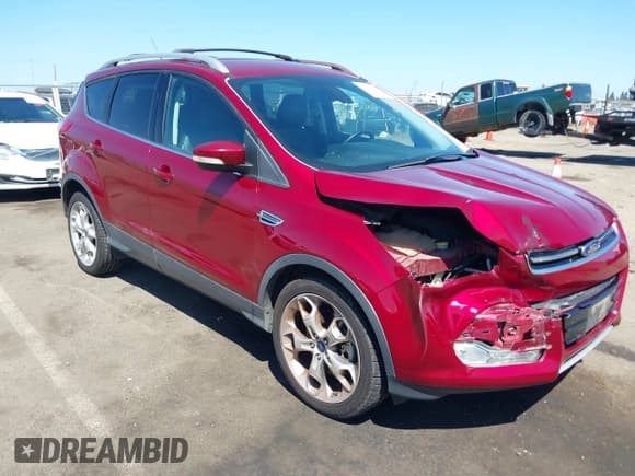 ✅ 2015 Ford Escape Titanium • VIN: 1FMCU0J93FUC89385 • Lot: 42328729. Listed on IAAI with 84,495 mi. Free auction sales archive from the USA and detailed vehicle history report at DreamBid. Image 1.
