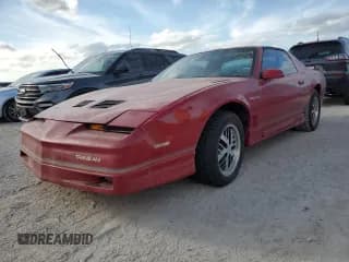✅ 1986 Pontiac Firebird Trans Am • VIN: 1G2FW87H0GL249284 • Lot: 76317174. Listed on Copart with 142,505 mi. Free auction sales archive from the USA and detailed vehicle history report at DreamBid. Image 1.