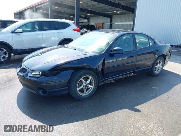 ✅ 2003 Pontiac Grand Prix GT • VIN: 1G2WP52K53F115653 • Lot: 42433273. Wystawiony na IAAI z przebiegiem 165 740 mil. Bezpłatny archiwum sprzedaży aukcyjnych z USA i szczegółowy raport historii pojazdu na DreamBid. Zdjęcie 2.