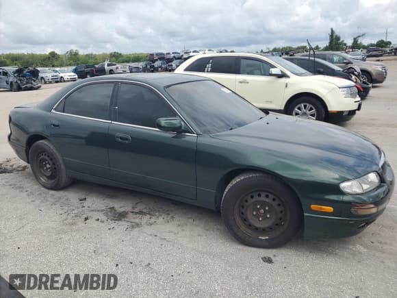 ✅ 1999 Mazda Millenia • VIN: JM1TA2217X1500480 • Lot: 70048645. Listed on Copart with 78,758 mi. Free auction sales archive from the USA and detailed vehicle history report at DreamBid. Image 4.