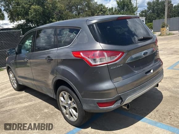 ✅ 2013 Ford Escape SEL • VIN: 1FMCU0HX5DUA87973 • Lot: 71736805. Wystawiony na Copart z przebiegiem Nie podano. Bezpłatny archiwum sprzedaży aukcyjnych z USA i szczegółowy raport historii pojazdu na DreamBid. Zdjęcie 3.